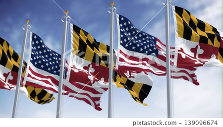 Maryland state flags waving with the american national flags on a clear day Maryland state flags waving with the american national flags on a clear day 139096674