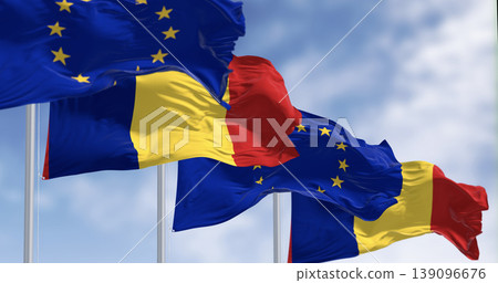 Romania and European Union flags waving in the wind on a clear day Romania and European Union flags waving in the wind on a clear day 139096676