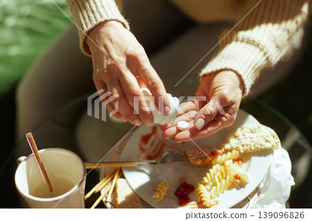 Pouring a Pill for Relief After a Processed Meal Pouring a Pill for Relief After a Processed Meal 139096826