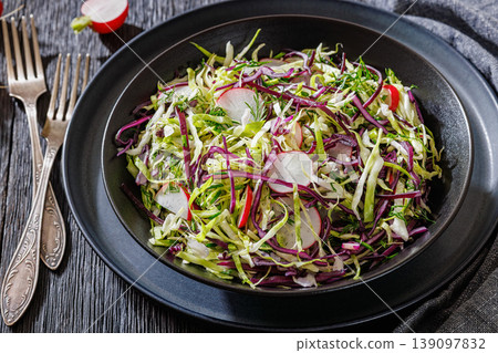 Fresh cabbage and radish coleslaw in a bowl 139097832