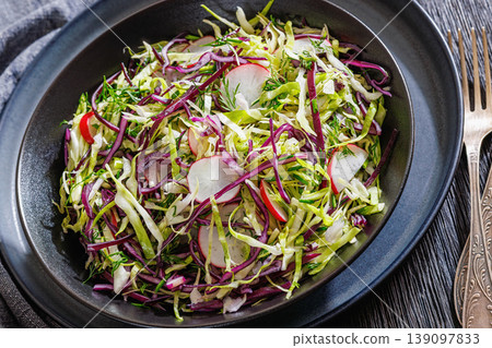 Fresh cabbage and radish coleslaw in a bowl Fresh cabbage and radish coleslaw in a bowl 139097833