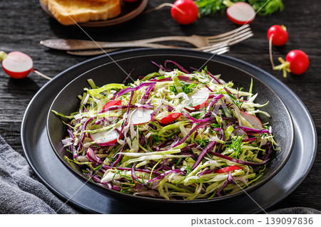 Fresh cabbage and radish coleslaw in a bowl Fresh cabbage and radish coleslaw in a bowl 139097836