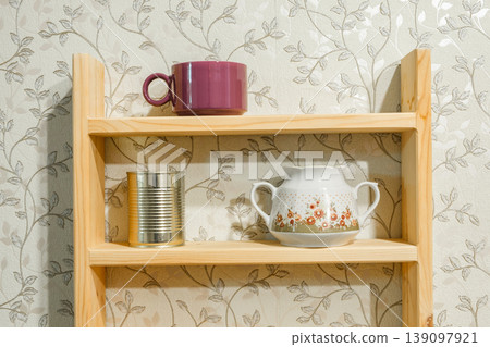 dishes and preserves on wooden shelves dishes and preserves on wooden shelves 139097921