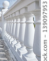 white fence with balusters and balls 139097953