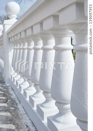 white fence with balusters and balls white fence with balusters and balls 139097953