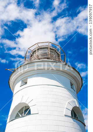white round lighthouse on background of the sky, bottom view white round lighthouse on background of the sky, bottom view 139097957