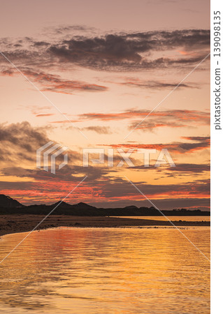 A beautiful sunset in Ishigaki Island where the crimson sky and sea blend together. 139098135