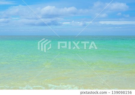 The scenery of Hirakubo Beach in Ishigaki Island, where the blue sky and emerald sea are stunning. The scenery of Hirakubo Beach in Ishigaki Island, where the blue sky and emerald sea are stunning. 139098156