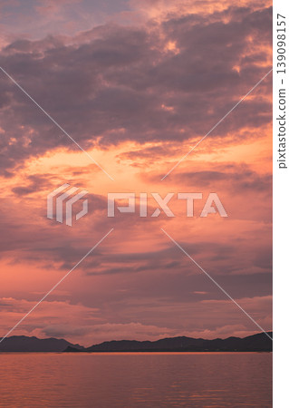 A beautiful sunset in Ishigaki Island where the crimson sky and sea blend together. A beautiful sunset in Ishigaki Island where the crimson sky and sea blend together. 139098157