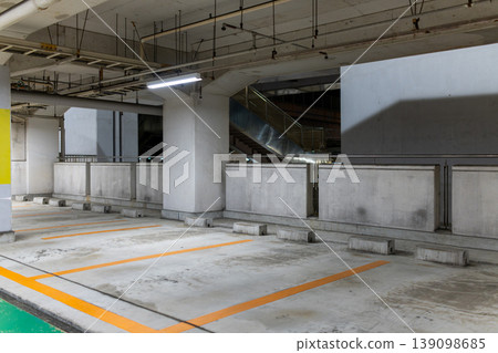 A concrete parking space enveloped in the silence of the night. A concrete parking space enveloped in the silence of the night. 139098685