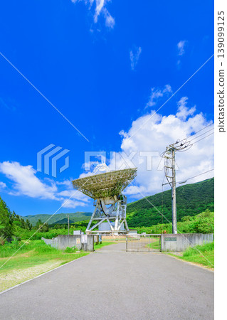 The giant radio telescope on Ishigaki Island stands out against the blue sky. 139099125