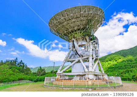 The giant radio telescope on Ishigaki Island stands out against the blue sky. The giant radio telescope on Ishigaki Island stands out against the blue sky. 139099126