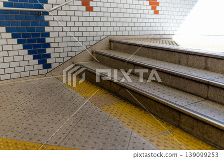 Background material of station stairs and tactile paving for the visually impaired. 139099253