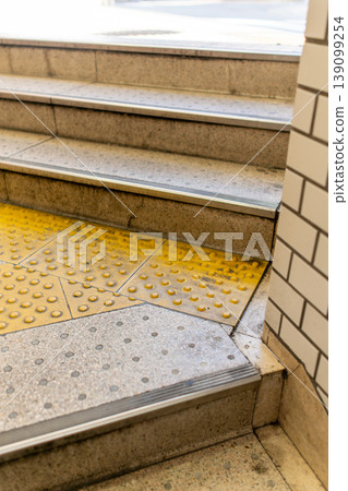 Background material of station stairs and tactile paving for the visually impaired. Background material of station stairs and tactile paving for the visually impaired. 139099254