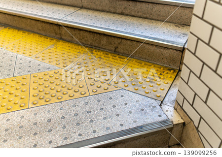 Background material of station stairs and tactile paving for the visually impaired. Background material of station stairs and tactile paving for the visually impaired. 139099256