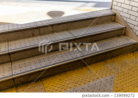Background material of station stairs and tactile paving for the visually impaired. Background material of station stairs and tactile paving for the visually impaired. 139099272