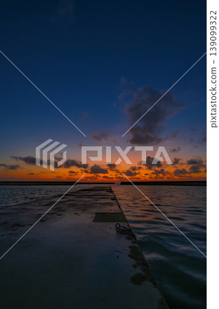 The sea and sky of Inoda Fishing Port are bathed in the morning light, creating a beautiful early morning scene. The sea and sky of Inoda Fishing Port are bathed in the morning light, creating a beautiful early morning scene. 139099322