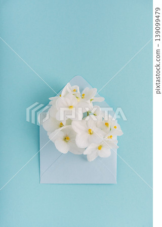 Blue Envelope with White Violet Flowers Blue Envelope with White Violet Flowers 139099479