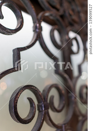 An abstract background with beautiful curves in antique-style ironwork. An abstract background with beautiful curves in antique-style ironwork. 139099527