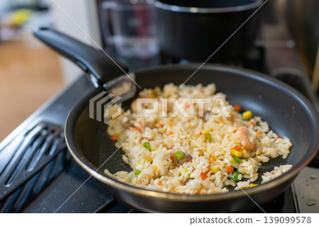 Close-up of shrimp fried rice made in a frying pan Close-up of shrimp fried rice made in a frying pan 139099578
