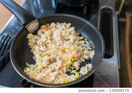 Close-up of shrimp fried rice made in a frying pan Close-up of shrimp fried rice made in a frying pan 139099579