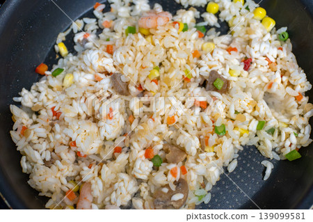 Close-up of shrimp fried rice made in a frying pan Close-up of shrimp fried rice made in a frying pan 139099581