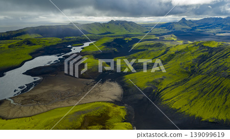 Aerial View of Iceland's Volcanic Landscape with River and Hills 139099619