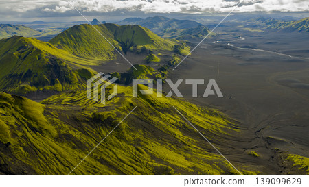 Aerial View of Iceland's Volcanic Landscape with Moss Covered Mountains Aerial View of Iceland's Volcanic Landscape with Moss Covered Mountains 139099629