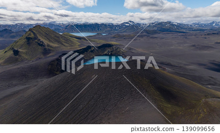 Aerial View of Volcanic Crater Lake and Snow Capped Mountains in Iceland Aerial View of Volcanic Crater Lake and Snow Capped Mountains in Iceland 139099656