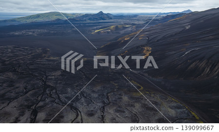 Aerial View of Volcanic Landscape and Winding Road in Iceland Aerial View of Volcanic Landscape and Winding Road in Iceland 139099667
