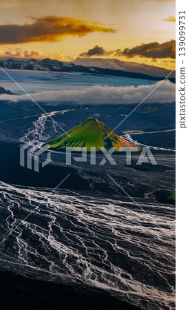 Aerial View of Green Volcanic Hill and Glacier in Iceland 139099731