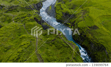 Aerial View of a Winding River in a Rugged Green Valley in Iceland Aerial View of a Winding River in a Rugged Green Valley in Iceland 139099764