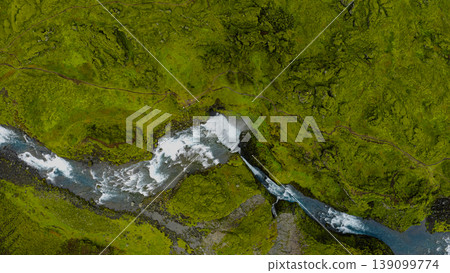 Aerial View of Icelandic Waterfall Cascading into a Winding River Aerial View of Icelandic Waterfall Cascading into a Winding River 139099774