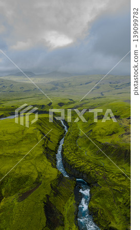 Aerial View of Icelandic Canyon with Winding River and Mossy Terrain Aerial View of Icelandic Canyon with Winding River and Mossy Terrain 139099782