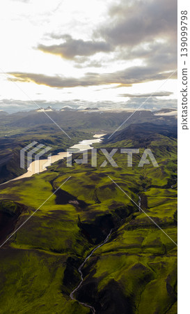 Aerial View of Iceland's Moss Covered Hills and Winding River Aerial View of Iceland's Moss Covered Hills and Winding River 139099798