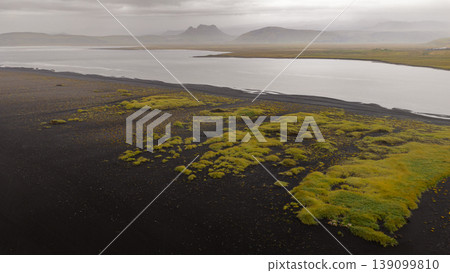 Aerial View of Volcanic Sand, Green Moss, and River in Iceland Aerial View of Volcanic Sand, Green Moss, and River in Iceland 139099810