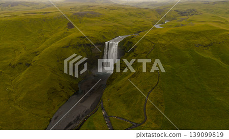 Aerial View of Skogafoss Waterfall and Surrounding Green Hills in Iceland Aerial View of Skogafoss Waterfall and Surrounding Green Hills in Iceland 139099819