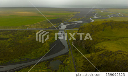 Aerial View of Icelandic River, Volcanic Plain, and Mossy Hill Aerial View of Icelandic River, Volcanic Plain, and Mossy Hill 139099823