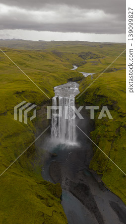 Aerial View of Skogafoss Waterfall and Surrounding Mossy Terrain 139099827