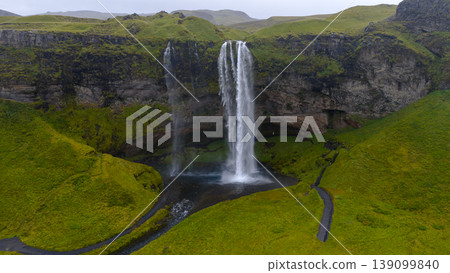 Aerial View of Seljalandsfoss Waterfall and Surrounding Cliffs in Iceland Aerial View of Seljalandsfoss Waterfall and Surrounding Cliffs in Iceland 139099840