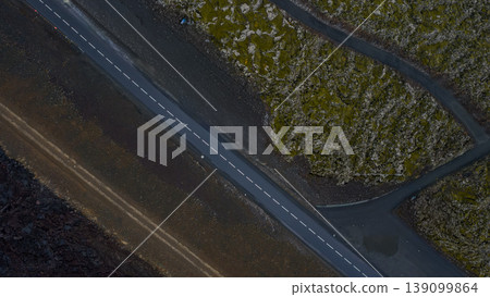 Aerial View of a Straight Road Through Iceland's Volcanic Terrain Aerial View of a Straight Road Through Iceland's Volcanic Terrain 139099864