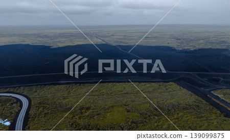 Aerial View of Iceland's Volcanic Landscape with Winding Road Aerial View of Iceland's Volcanic Landscape with Winding Road 139099875