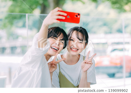 Women taking selfies on a girls' trip 139099902