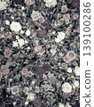A surface filled with various flowers shows a mix of muted colors and vintage style. The floral design creates a texture ideal for crafts and decoration. 139100286