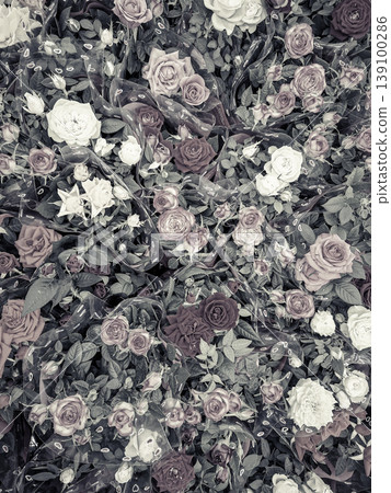 A surface filled with various flowers shows a mix of muted colors and vintage style. The floral design creates a texture ideal for crafts and decoration. 139100286