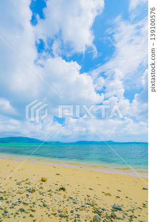 A refreshing summer scene of Ishigaki Island, with its beautiful sea and sandy beaches, and white clouds spreading across the horizon. A refreshing summer scene of Ishigaki Island, with its beautiful sea and sandy beaches, and white clouds spreading across the horizon. 139100576