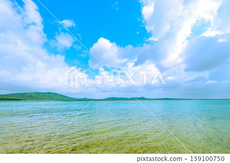 The clear waters of the shallows and the beautiful blue sky create a tranquil summer seascape on Ishigaki Island. The clear waters of the shallows and the beautiful blue sky create a tranquil summer seascape on Ishigaki Island. 139100750