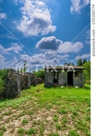 The memory of the remains of the submarine cable landing station on Ishigaki Island, standing quietly in a grassy field. The memory of the remains of the submarine cable landing station on Ishigaki Island, standing quietly in a grassy field. 139100774