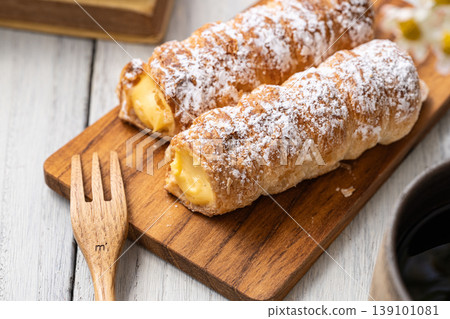 Cornet on a wooden plate Cornet on a wooden plate 139101081