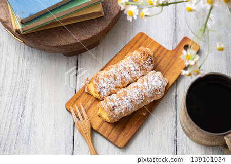 Cornet on a wooden plate 139101084